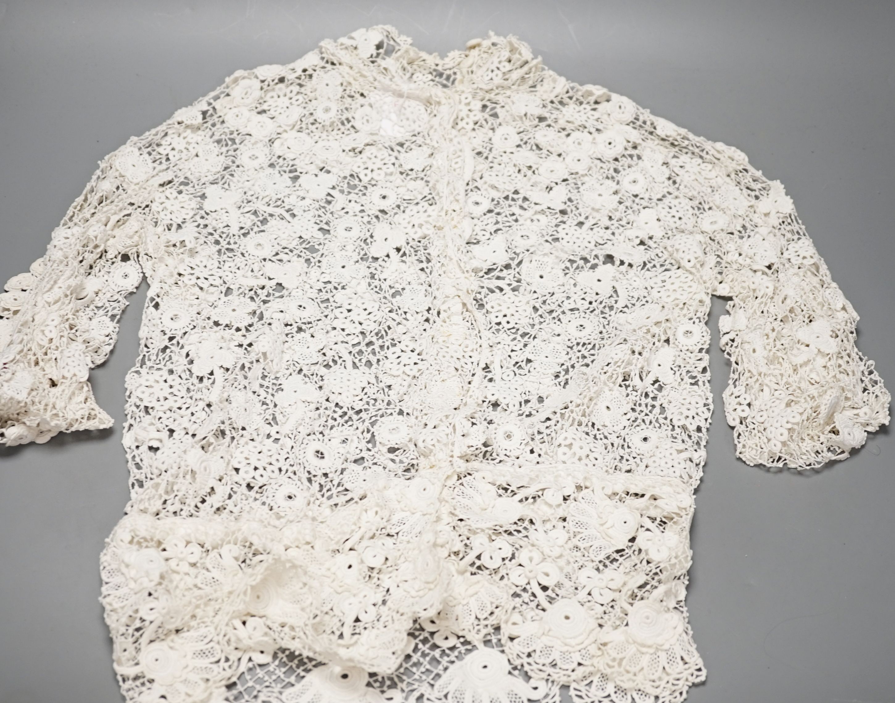 A 19th century hand made Irish crochet jacket, with long sleeves and high collar, a bobbin lace and white worked patch worked blouse, a fine lawn and anglaise worked blouse and a fine bobbin lace trimmed and white worked